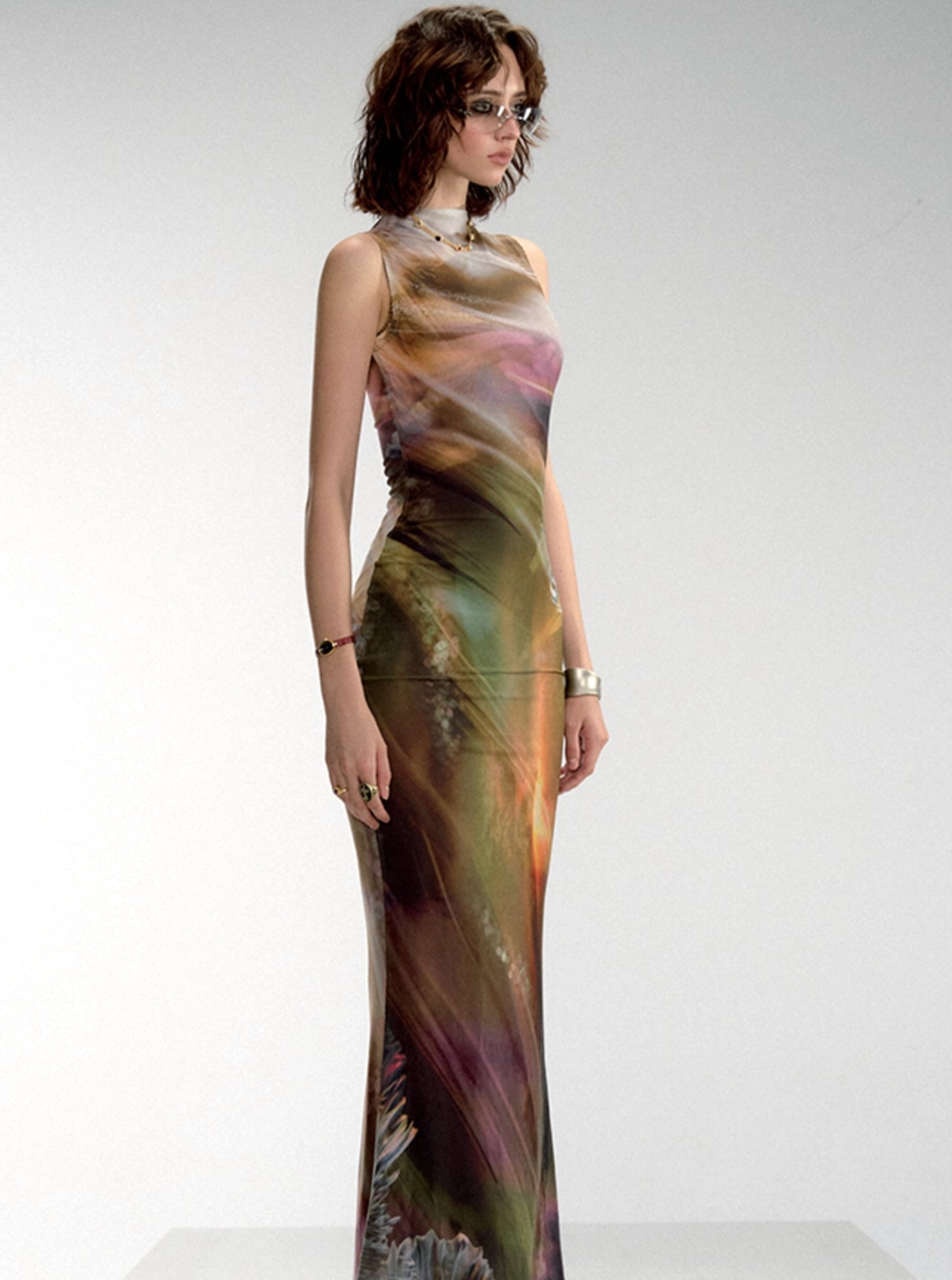 Aurora print sleeveless bodycon maxi dress with a high mock neck and fitted fishtail silhouette side view