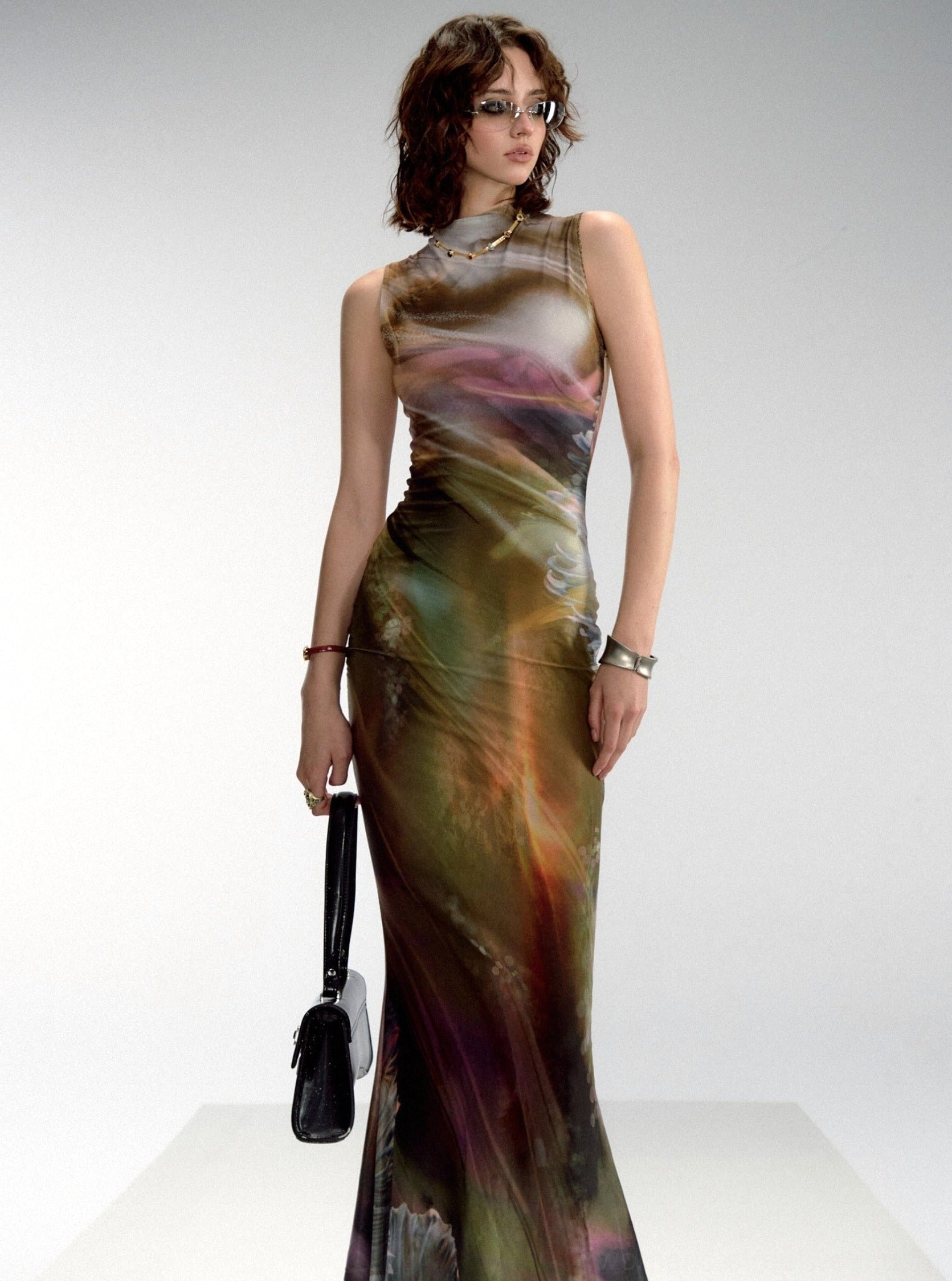 Green aurora print sleeveless mock neck fishtail maxi dress in a fitted full-length front view