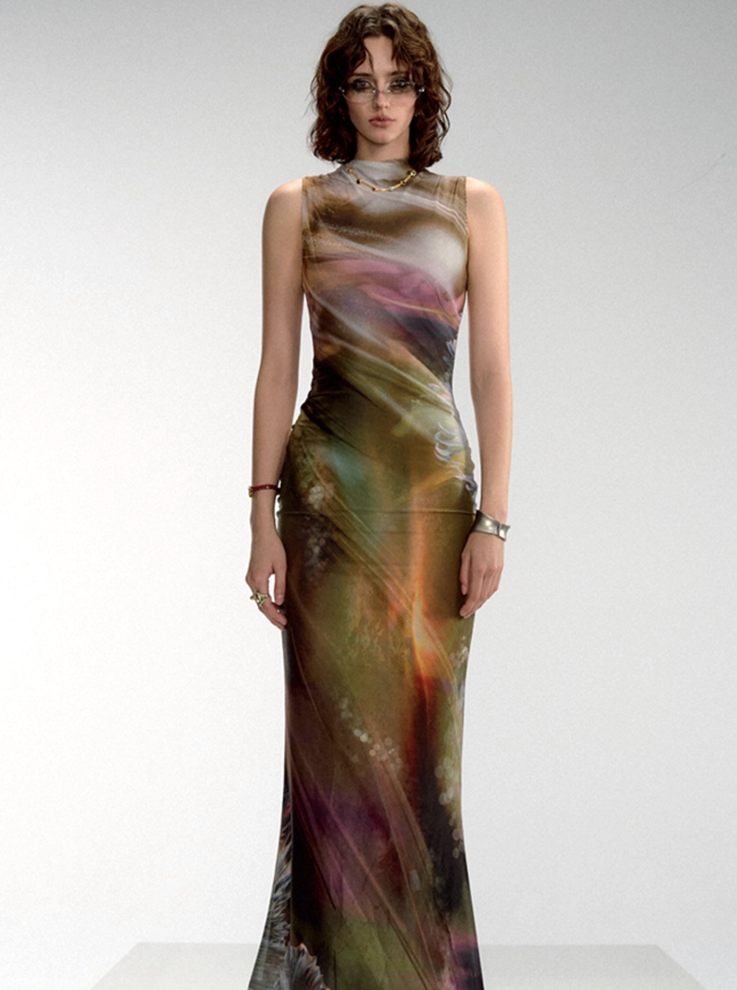 Warm aurora gradient mock neck sleeveless fishtail maxi dress shown in a straight front full-body studio view