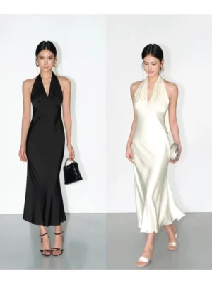 Black and milk apricot backless halter satin maxi dresses shown in a full body studio view