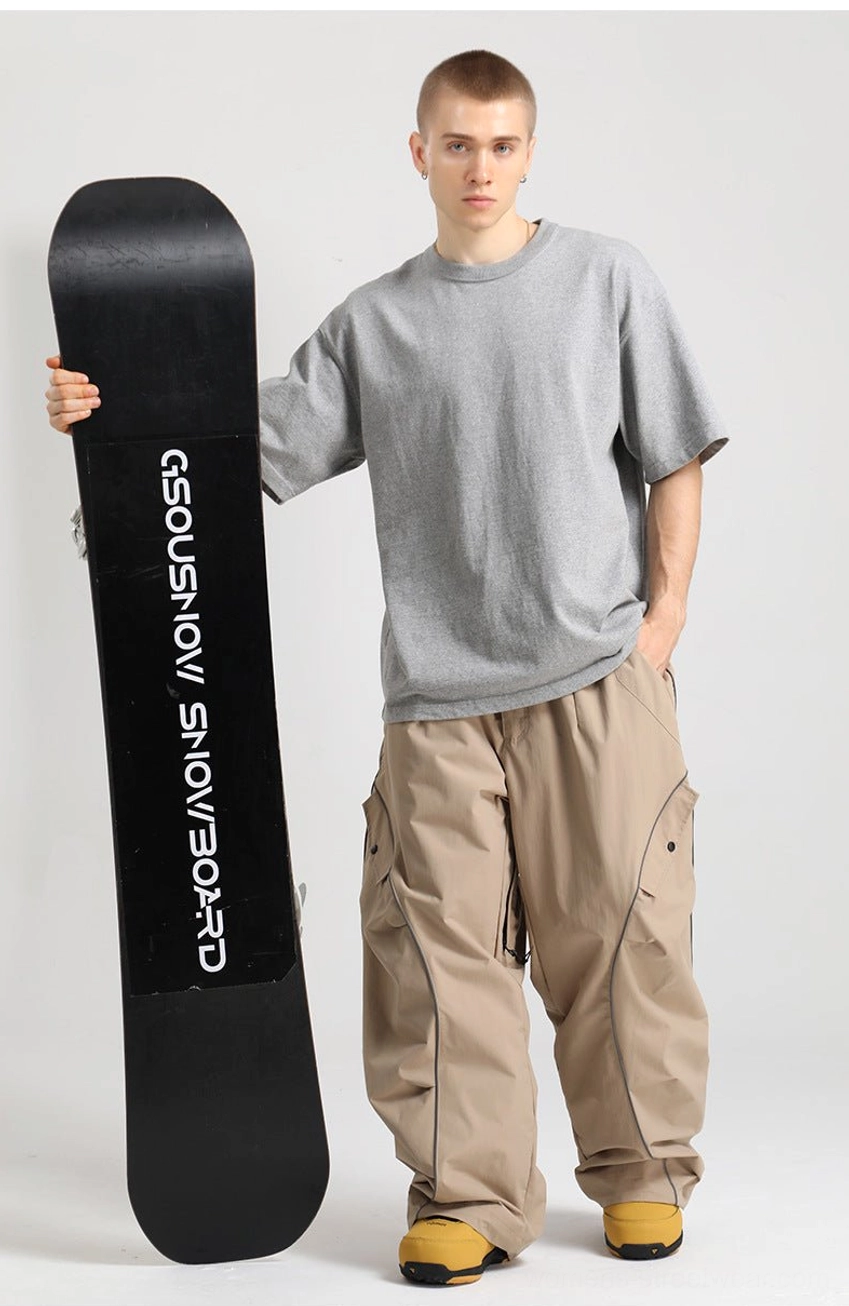 Baggy snowboard cargo pants with reflective piping designed for gorpcore and winter streetwear outfits