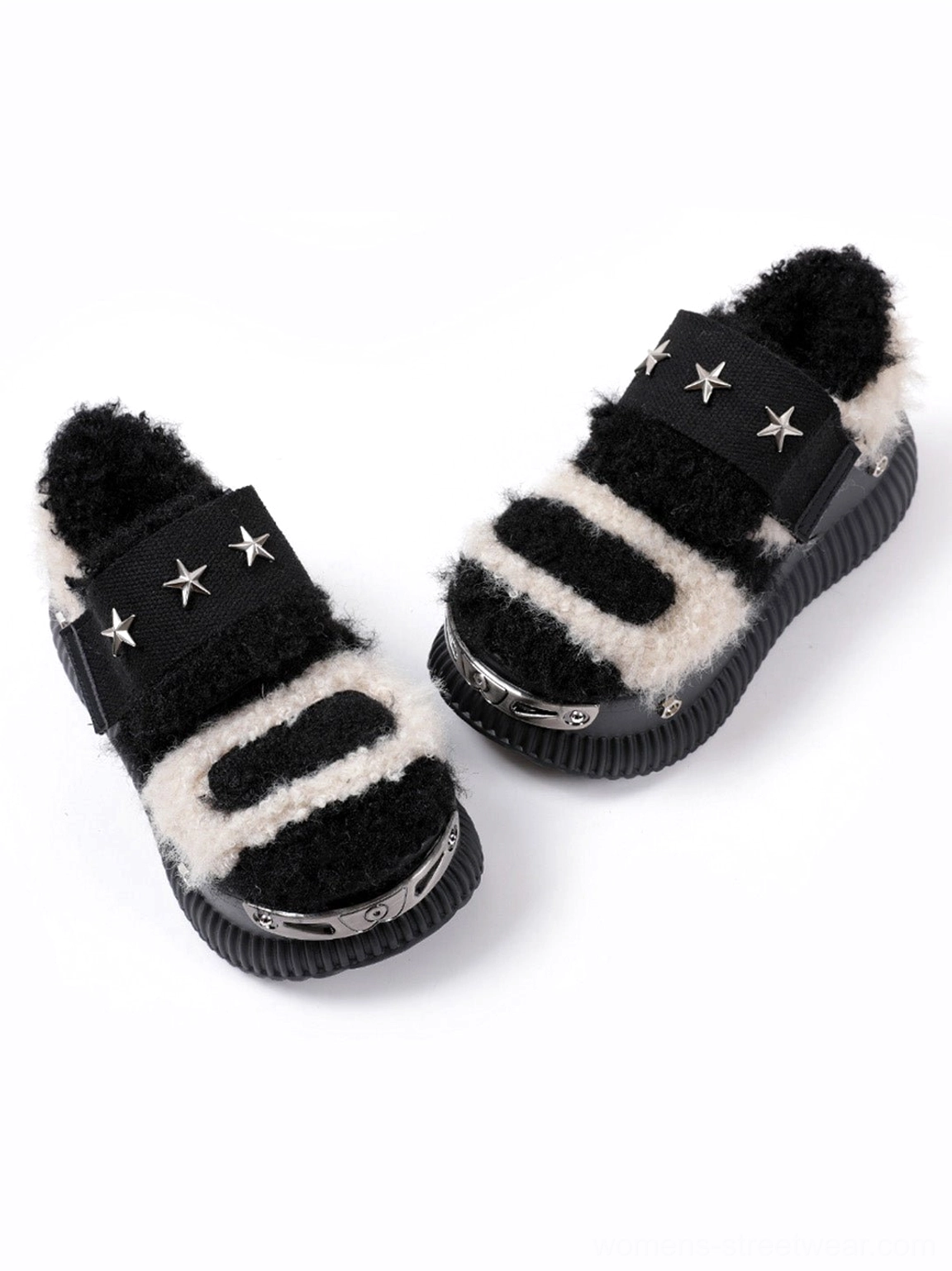 Top-down view of beige and black patchwork Y2K platform sneakers with silver star rivets and textured ridged soles