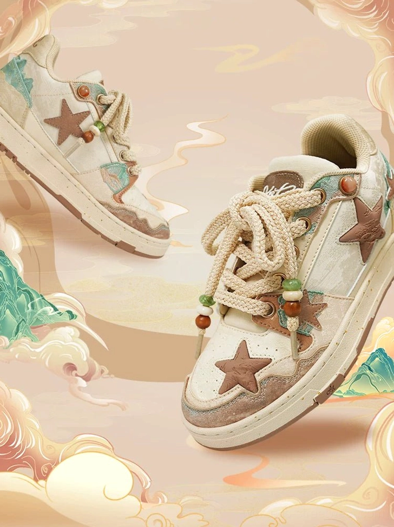 Beige and brown retro star sneakers floating against an East Asian ink painting background with mountains and clouds