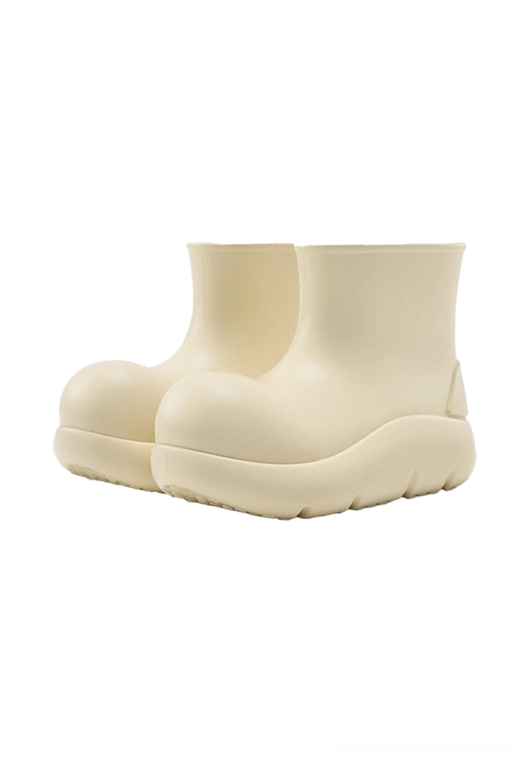 Beige chunky short rain boots front three quarter product view with seamless rubber upper and platform sole