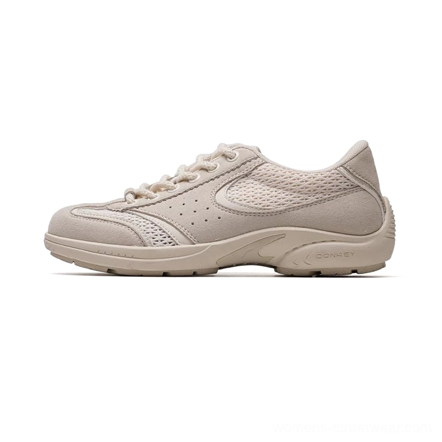 Beige cream retro streetwear sneakers with suede mesh hybrid upper matching rubber sole and perforated breathable details