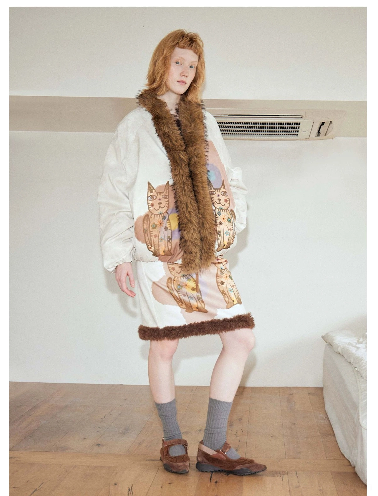 Beige faux fur cat print bomber jacket styled with a furry hem mini skirt in a relaxed women's Seoul streetwear outfit