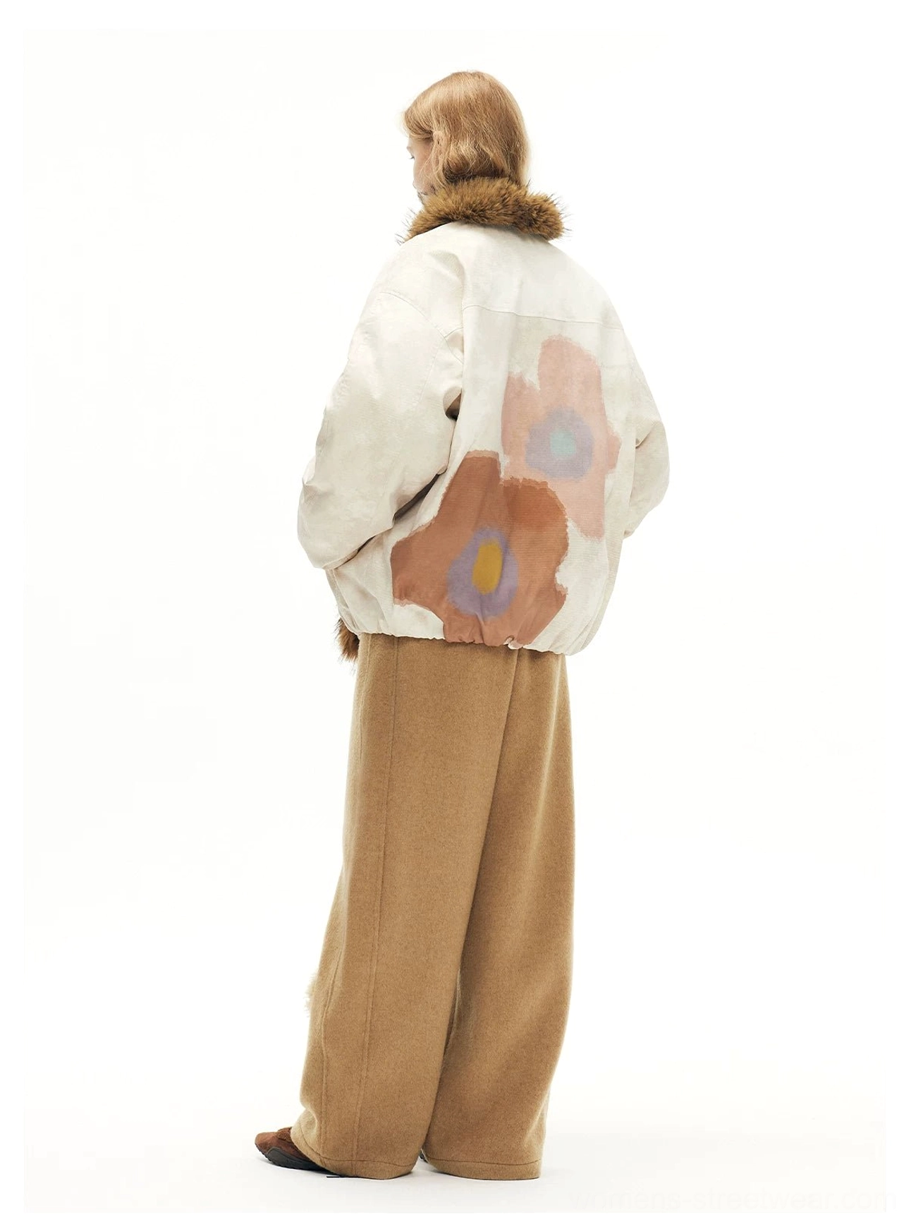 Back view of beige faux fur cat print bomber jacket featuring large floral artwork and an oversized streetwear silhouette