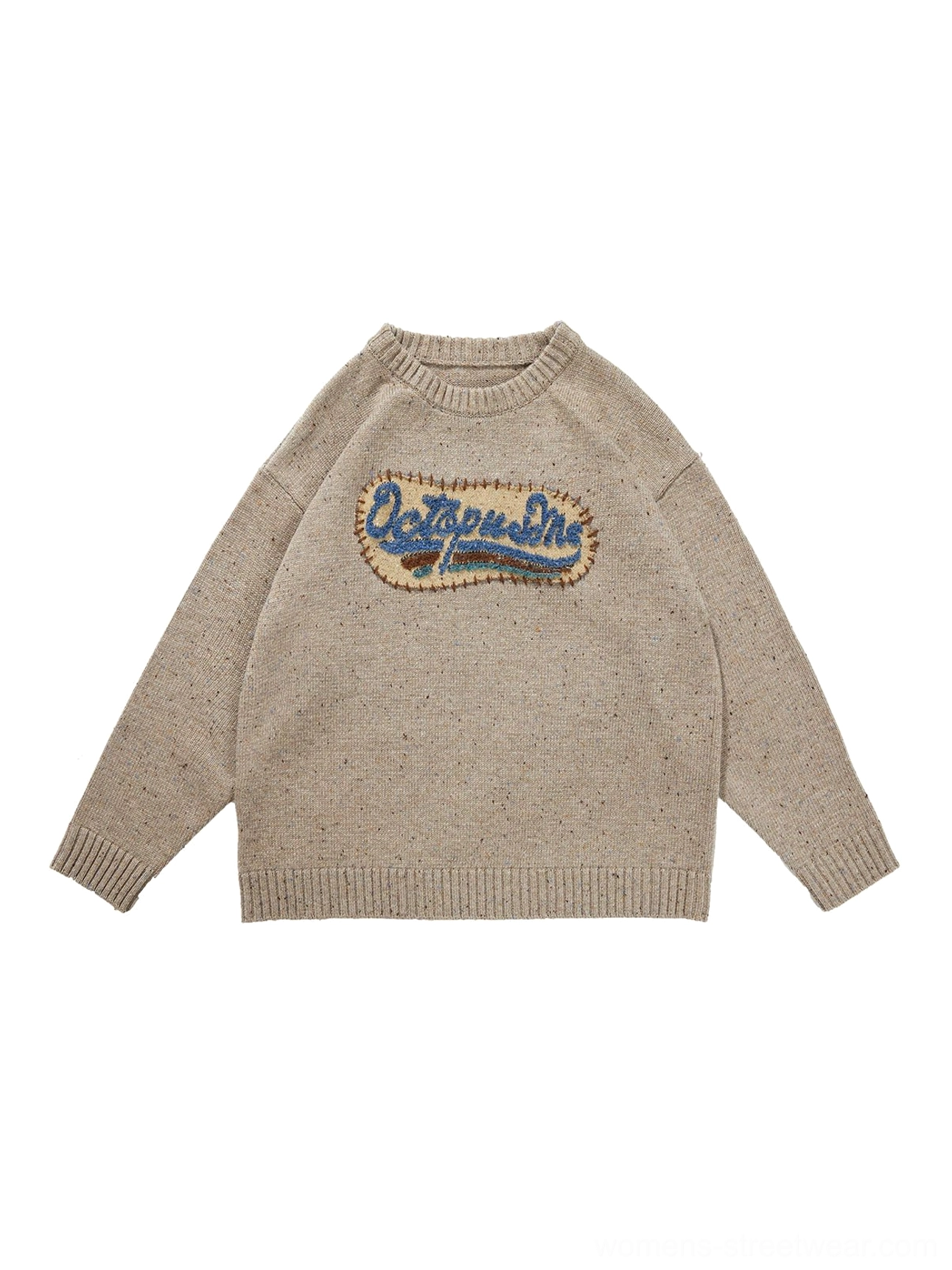 Flat lay view of beige gray heathered oversized crewneck knit sweater showing ribbed neckline, cuffs, hem, textured fabric, and embroidered patch