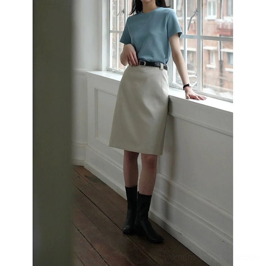 Beige gray knee-length belted skirt shown from the side with a subtle asymmetrical hem and modern Seoul-inspired minimalist styling