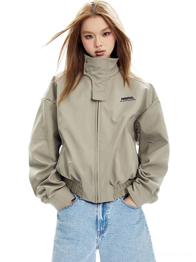 Beige high-collar cropped bomber jacket shown from the front with a relaxed boxy fit, ribbed cuffs, gathered hem, and light blue denim styling