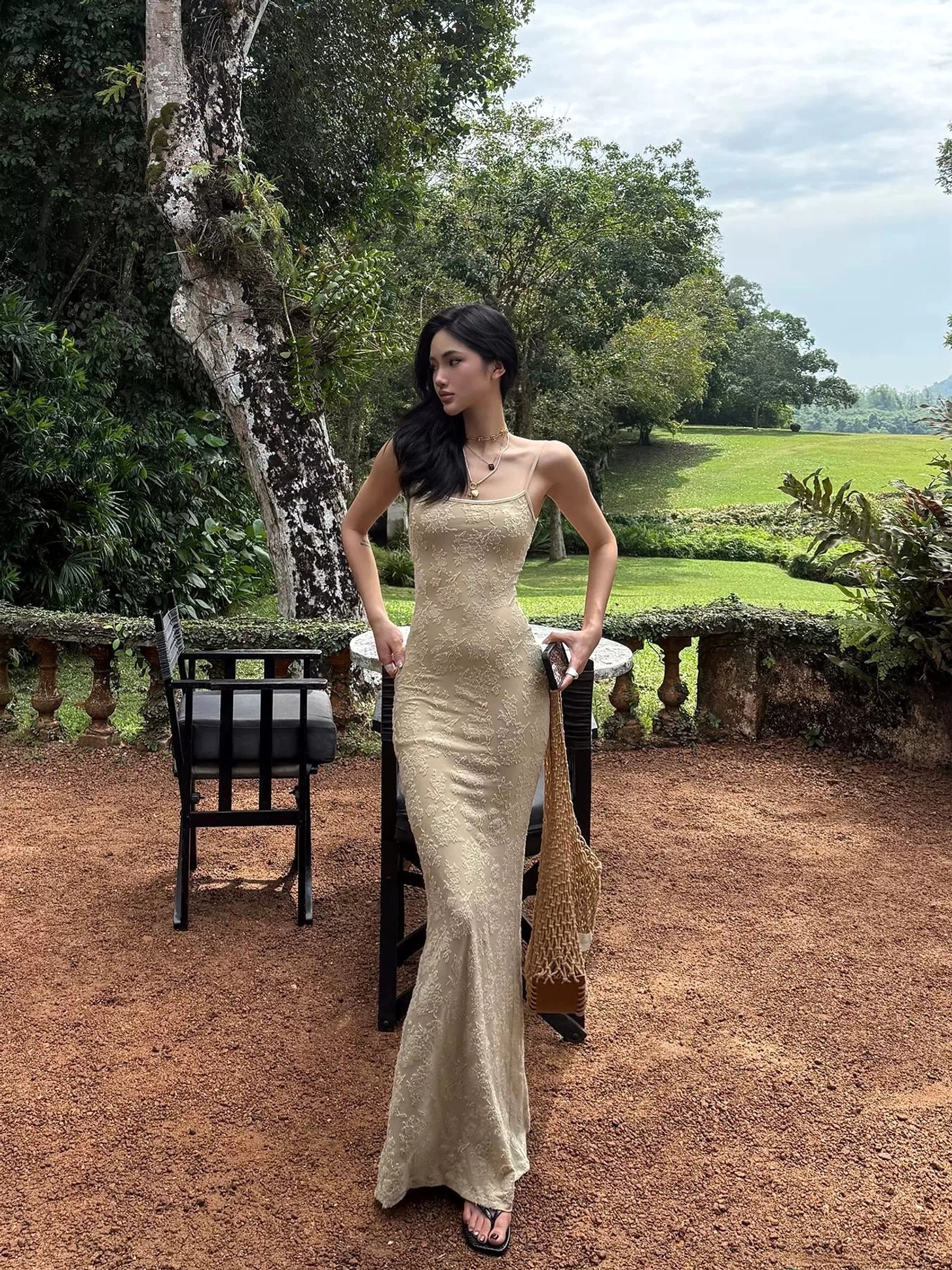 Beige lace fishtail maxi dress with slim tailored silhouette square neckline and all-over floral lace texture