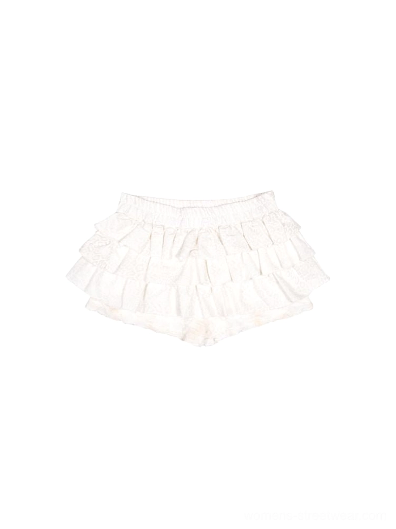 Beige color option of lace ruffle skort pants with layered feminine Acubi streetwear silhouette