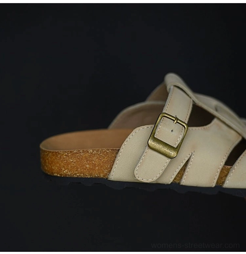 Side profile of beige leather fisherman sandals showing the woven cutout straps, gold-tone buckle, layered cork-style midsole, and textured rubber outsole