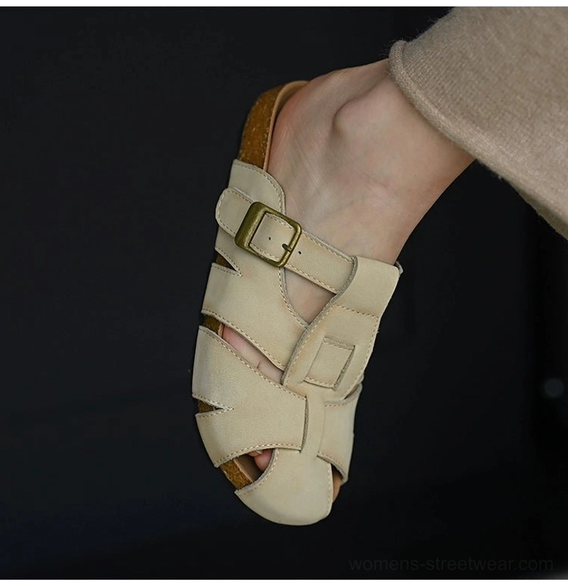 Beige leather fisherman sandals with woven cutout upper, adjustable buckle strap, rounded closed toe, cushioned footbed, and layered cork-style sole