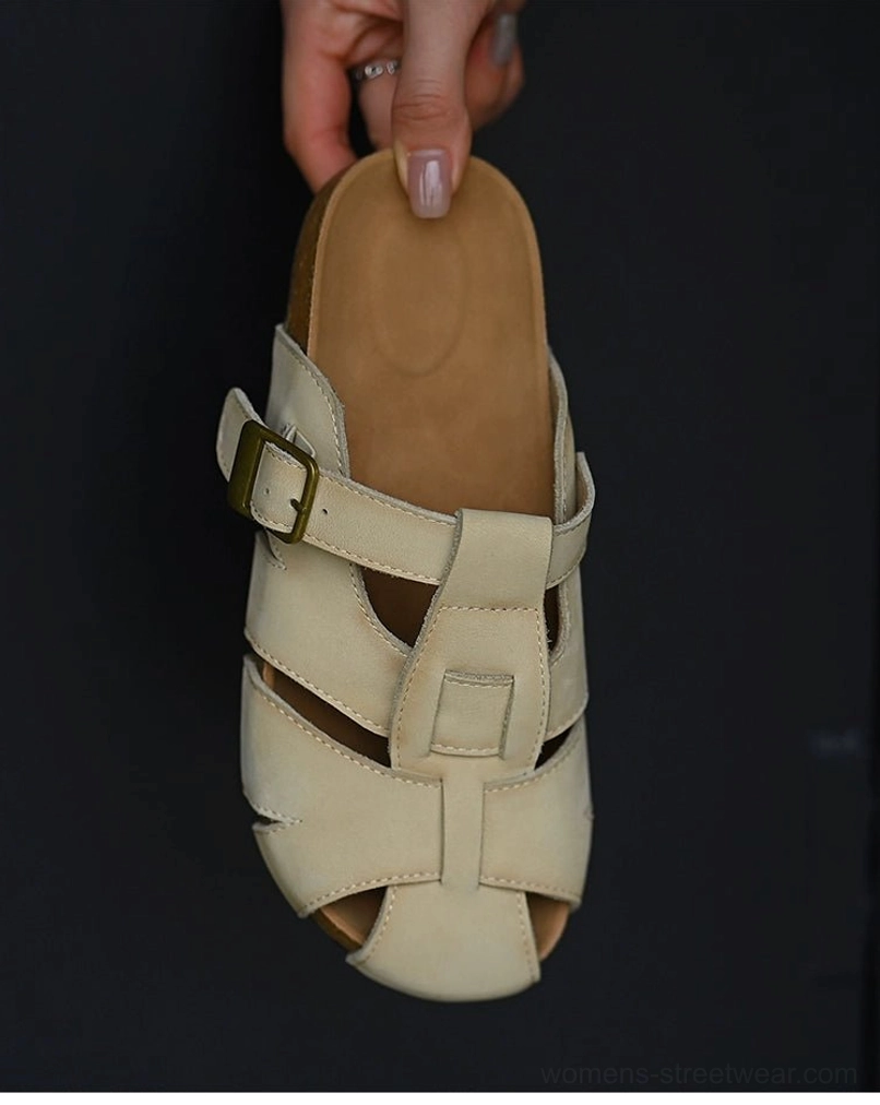 Top-down detail of beige leather fisherman sandals displaying the woven upper structure, cushioned footbed, rounded toe, and adjustable buckle strap