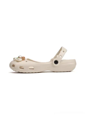 Beige Mary Jane slide sandals shown in side profile with breathable hollow upper adjustable heel strap and floral pearl toe decorations