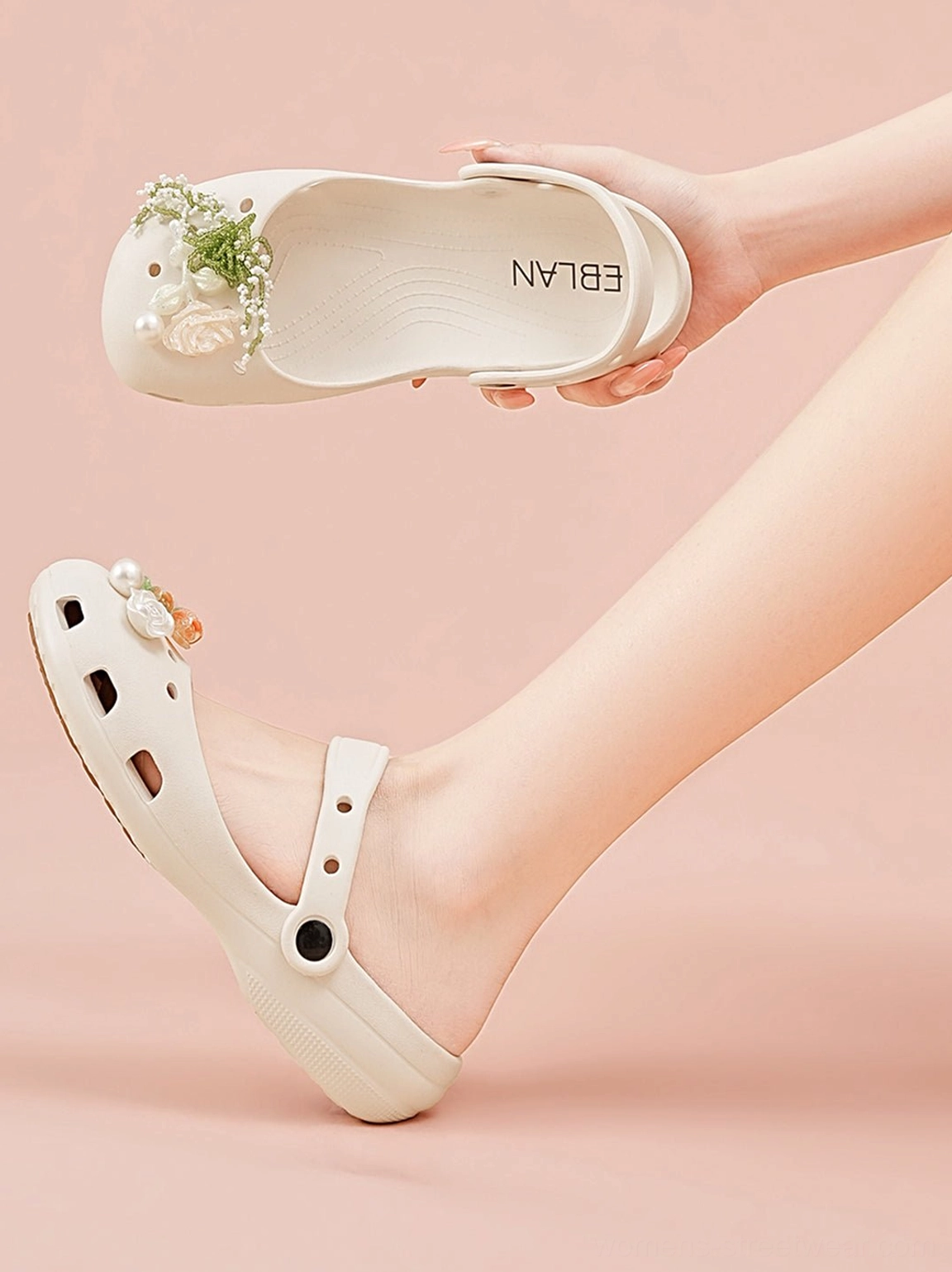 Beige Mary Jane slide sandals shown from insole and side views with adjustable strap floral toe ornament and lifted sole