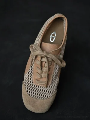 Beige mesh suede lace-up sneakers shown from a front top-down view with a soft suede toe cap, breathable mesh upper, and detailed insole