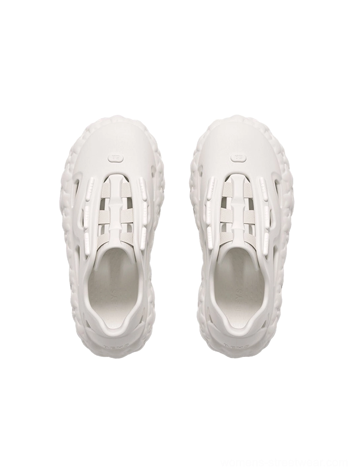 Top-down view of beige platform sandals highlighting the cutout upper, footbed, insole details, and star-patterned sole