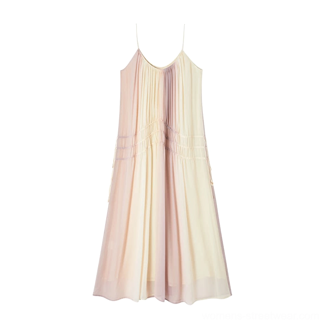Flat lay of beige purple gradient drawstring maxi slip dress with spaghetti straps and tassels