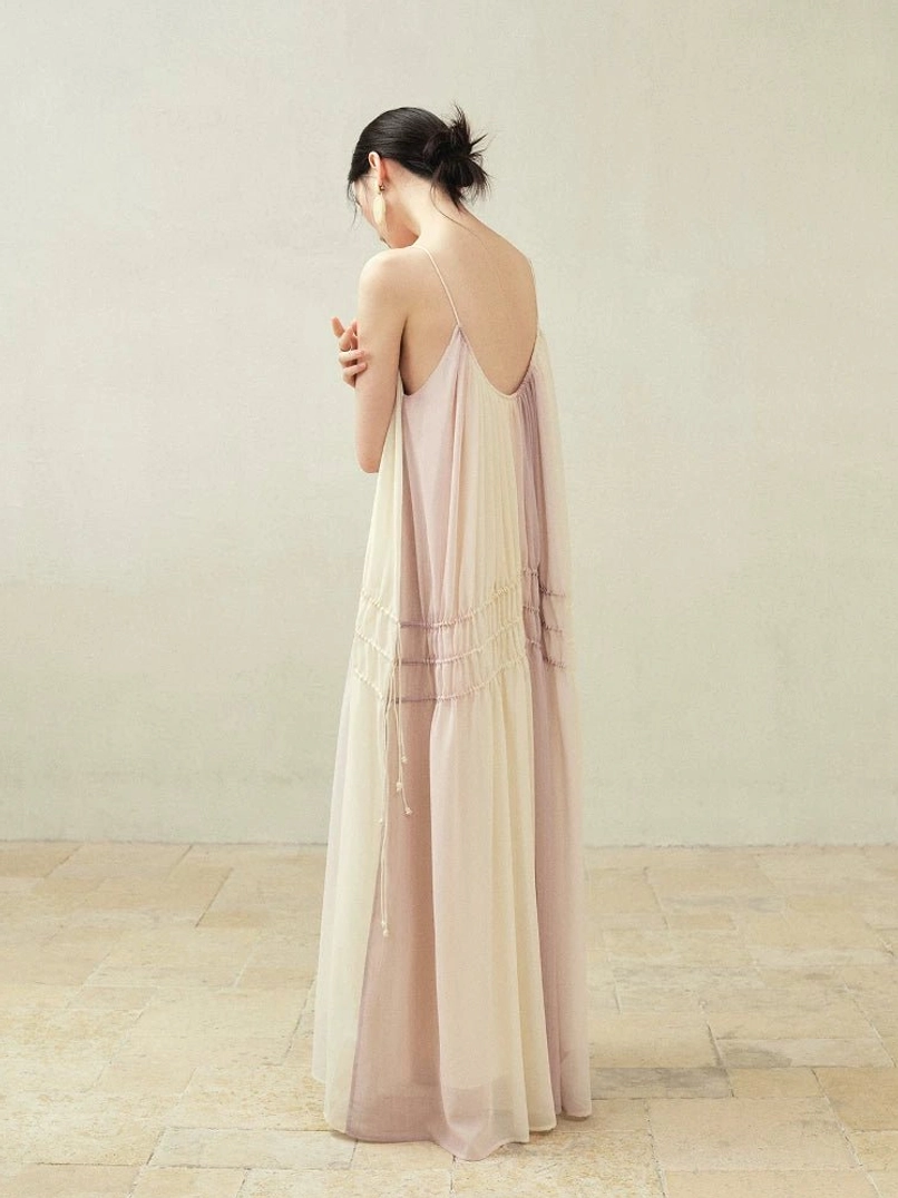 Side back view of flowy beige purple gradient drawstring maxi slip dress