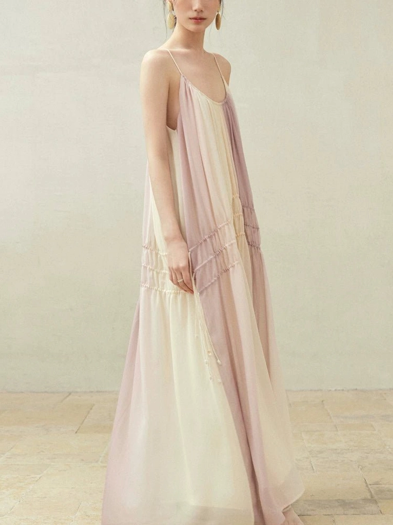 Side view of beige purple gradient maxi slip dress with V neckline and ruched drawstring front