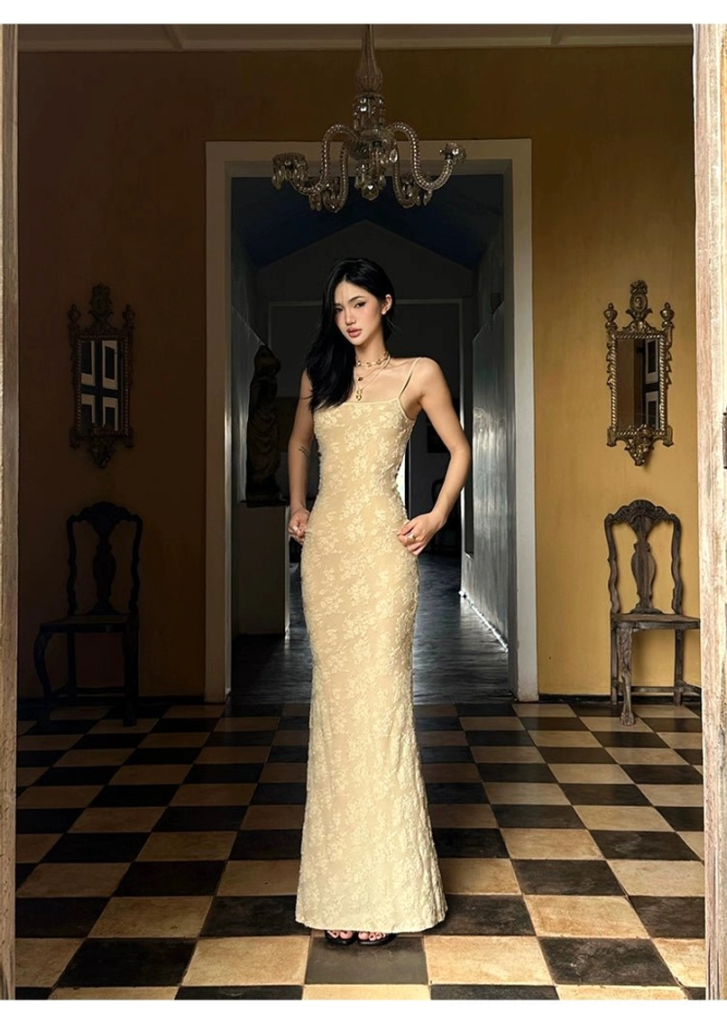 Beige romantic lace maxi dress with adjustable spaghetti straps fitted bodycon shape and contemporary resort style