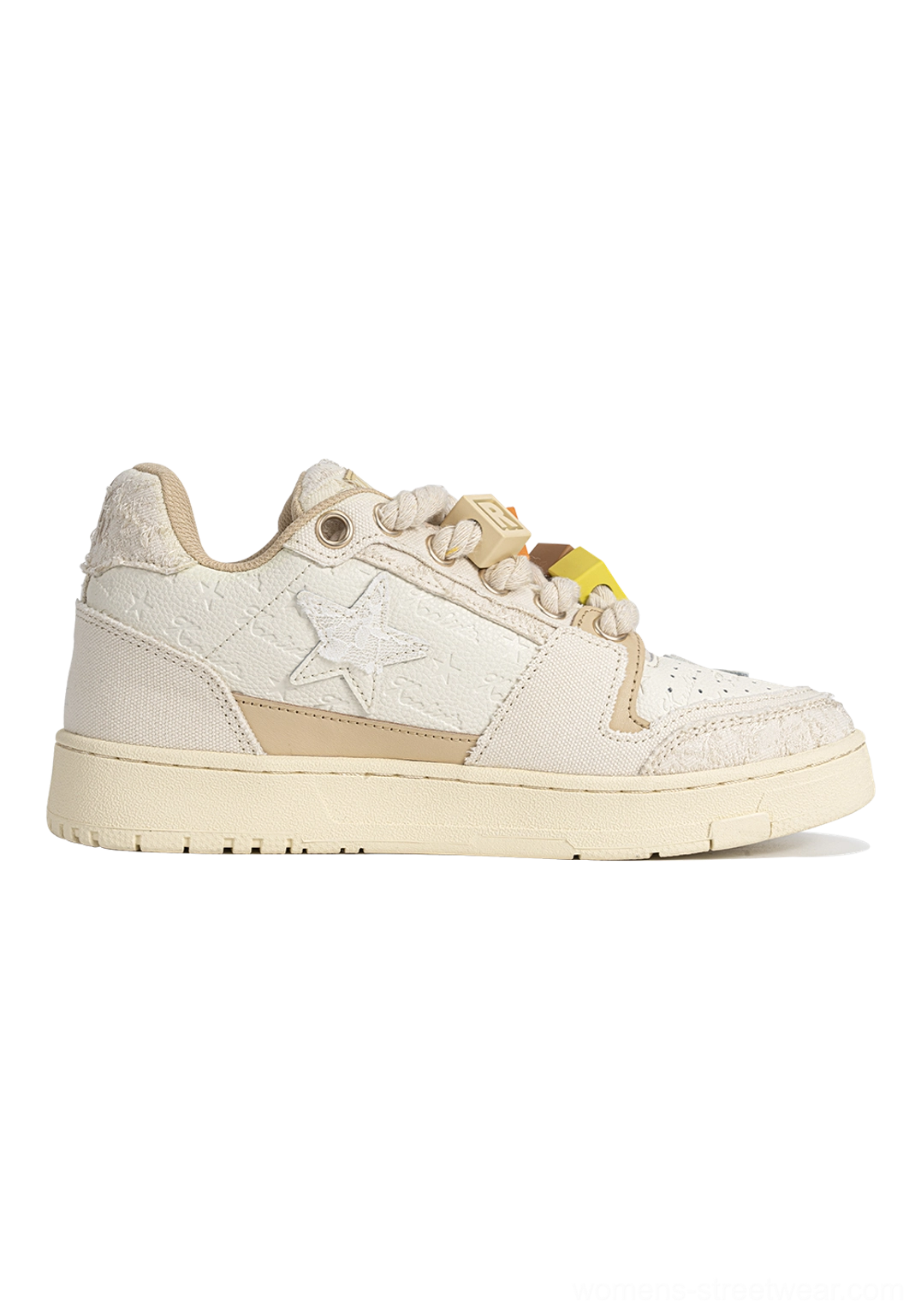 Beige star low-top sneaker showing inner and outer sides, chunky rope laces, decorative lace charms, textured upper, and distressed sole
