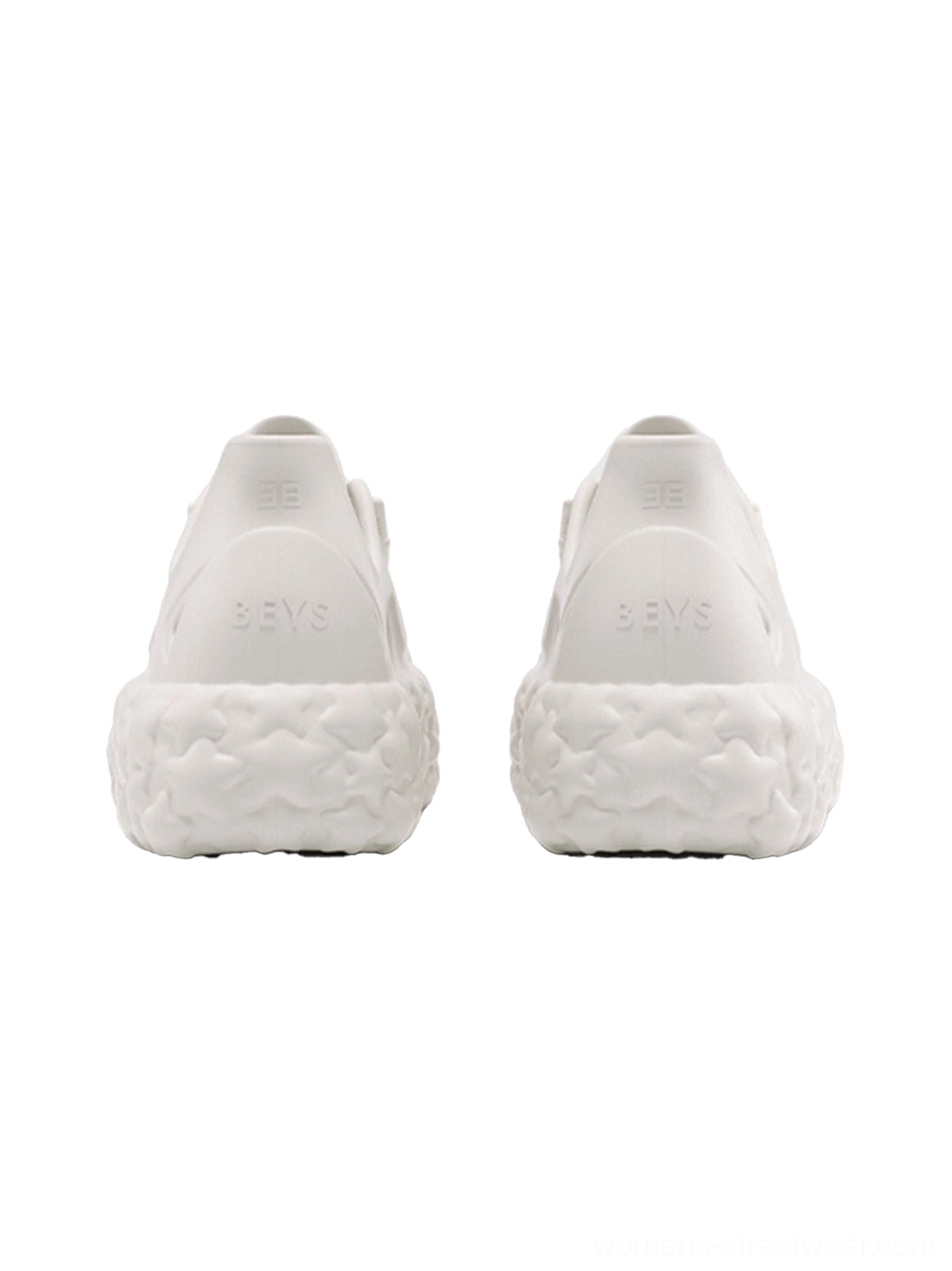 Rear view of a pair of beige star platform sandals showing the rugged star-shaped outsole and heel counter details