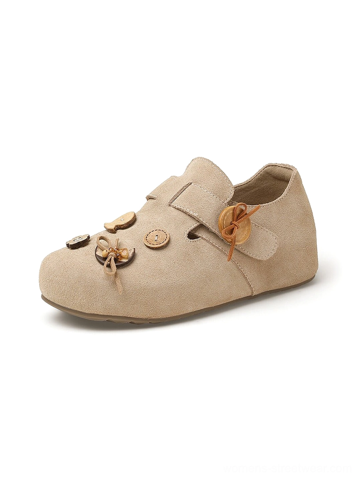 Beige suede-look button strap slip-on shoe side view showing rounded toe decorative buttons and flat flexible sole