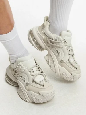 Beige Vortex Mesh Air Cushion Platform Sneakers on foot showing elevated chunky sole and beige streetwear silhouette