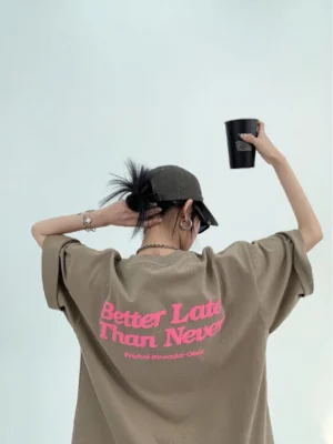 Light coffee Better Late Than Never oversized neon script streetwear tee back view with pink slogan graphic