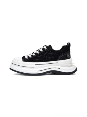 Black 7 cm layered platform canvas sneaker shown from the left side with white laces, stacked white sole, and low-top streetwear silhouette