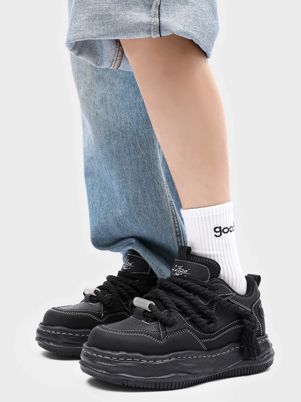 Black 7CM platform sneakers worn with cropped light blue jeans and crew socks in a casual streetwear outfit