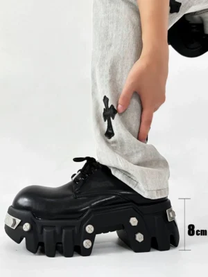 Side profile of black 8cm platform Oxford shoes showing the elevated platform height, lace-up closure, silver studs, and rugged rubber sole
