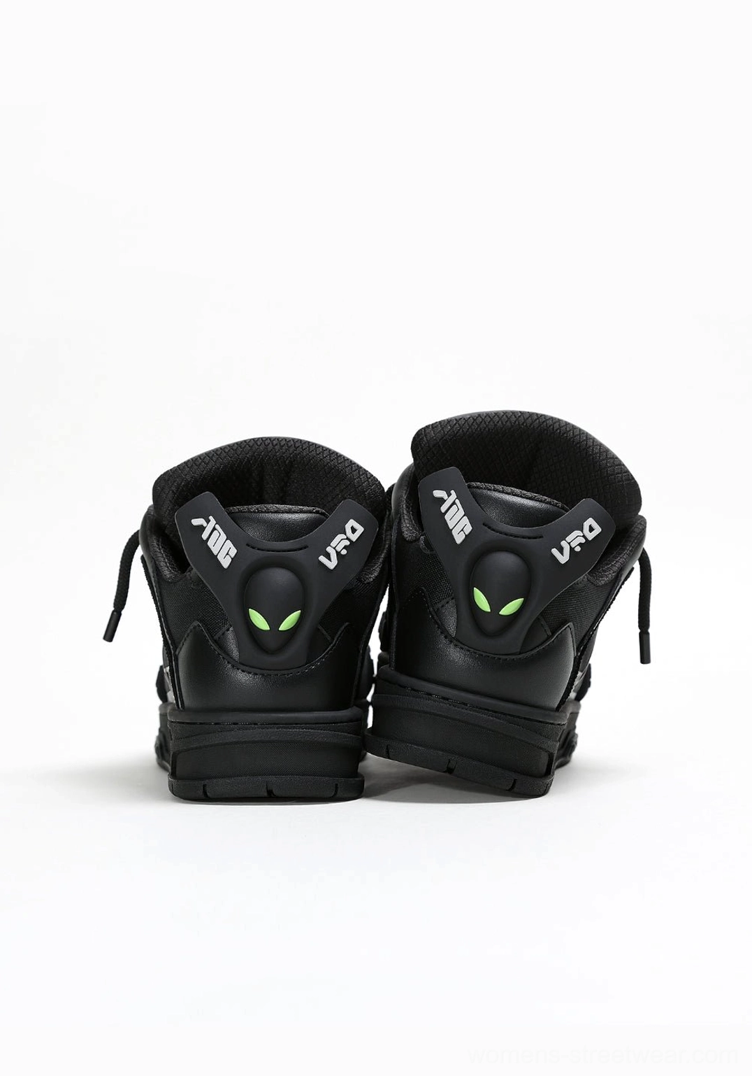 Black alien head platform sneakers with bold elevated sole for futuristic Korean streetwear styling