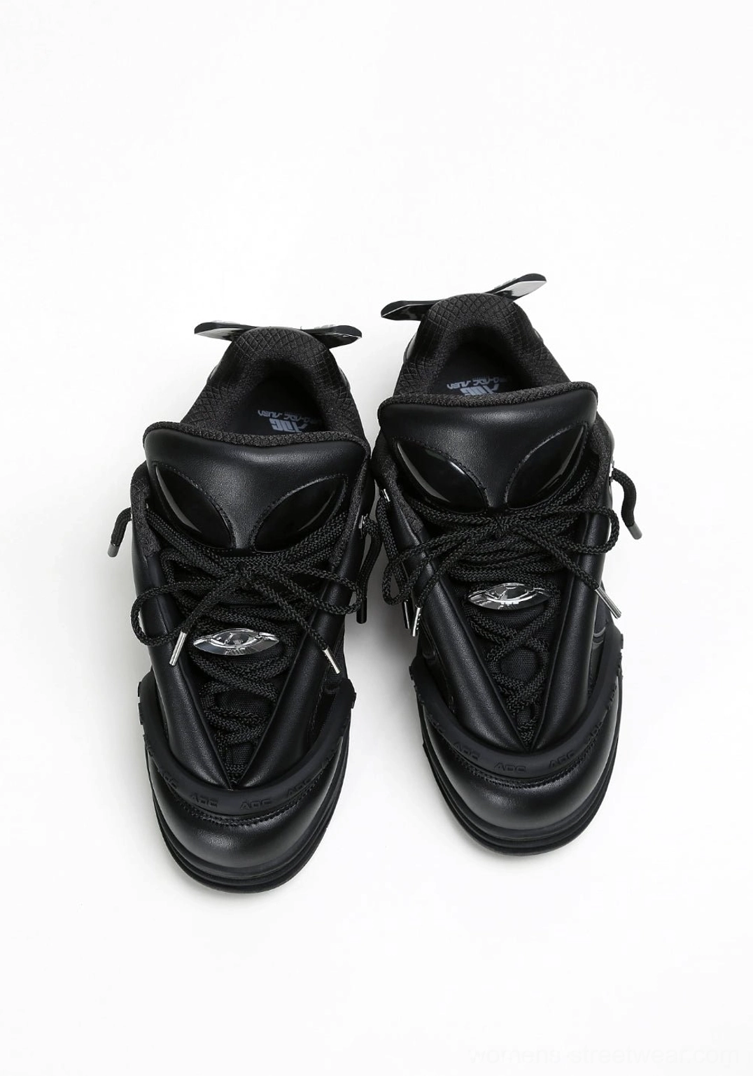 Black alien head platform sneakers product view featuring lace-up construction and sculptural streetwear sole