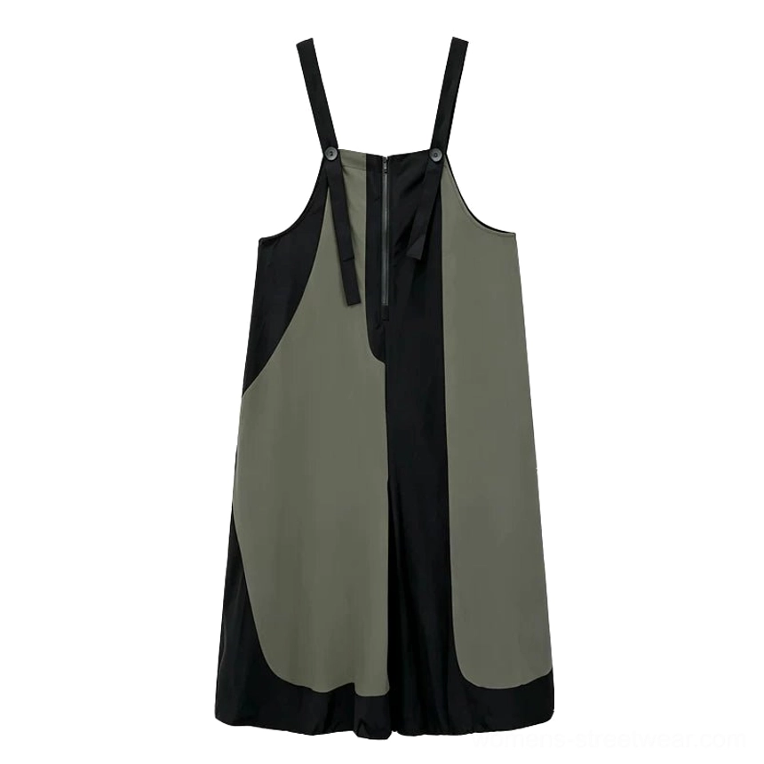 Flat front view of a black and army green patchwork streetwear jumpsuit with adjustable shoulder straps, front zipper, and drawcord balloon cuffs
