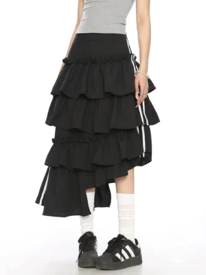 Back three quarter view of black asymmetric layered ruffle midi skirt with contrast white stripe ribbon side details