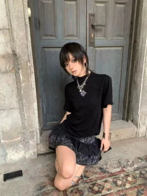 Black asymmetric mock neck sigil tee styled with a dark lace skirt for gothic Seoul streetwear fashion