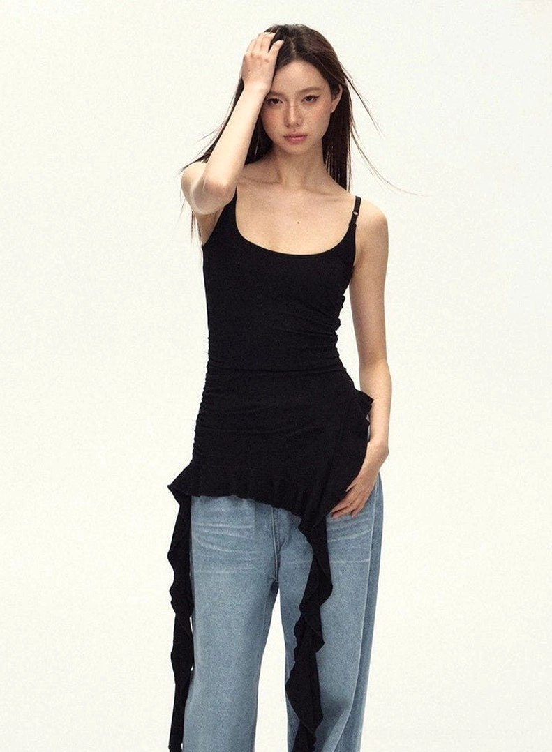 Black asymmetric ruched cami top with fitted silhouette and flowing ruffled hem for Seoul-inspired women's streetwear
