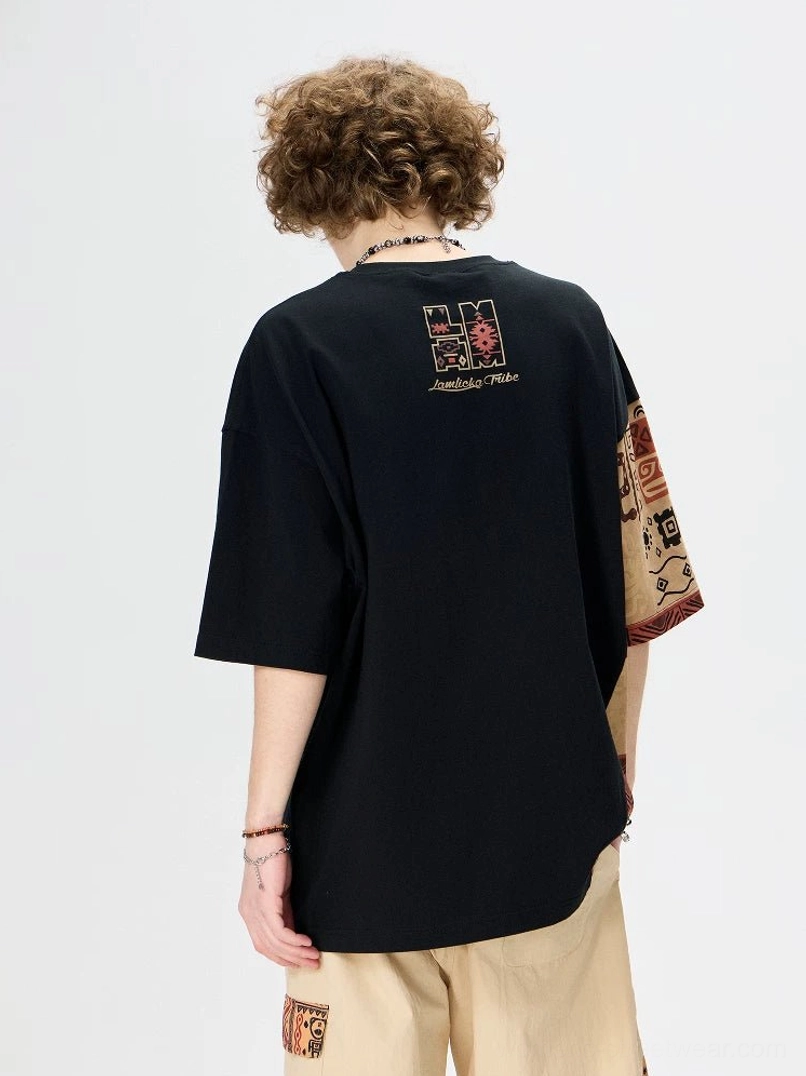 Black asymmetric tribal panel oversized heavyweight cotton T-shirt back view with warm brown patterned sleeve and side panel