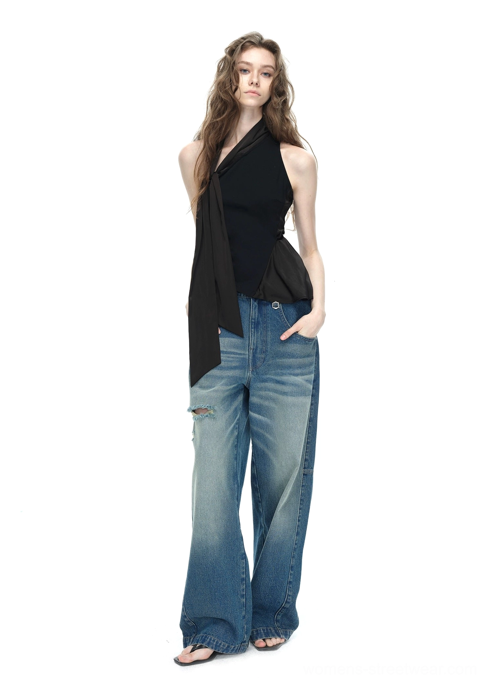 Black asymmetrical halter top with adjustable side tie sash product detail view