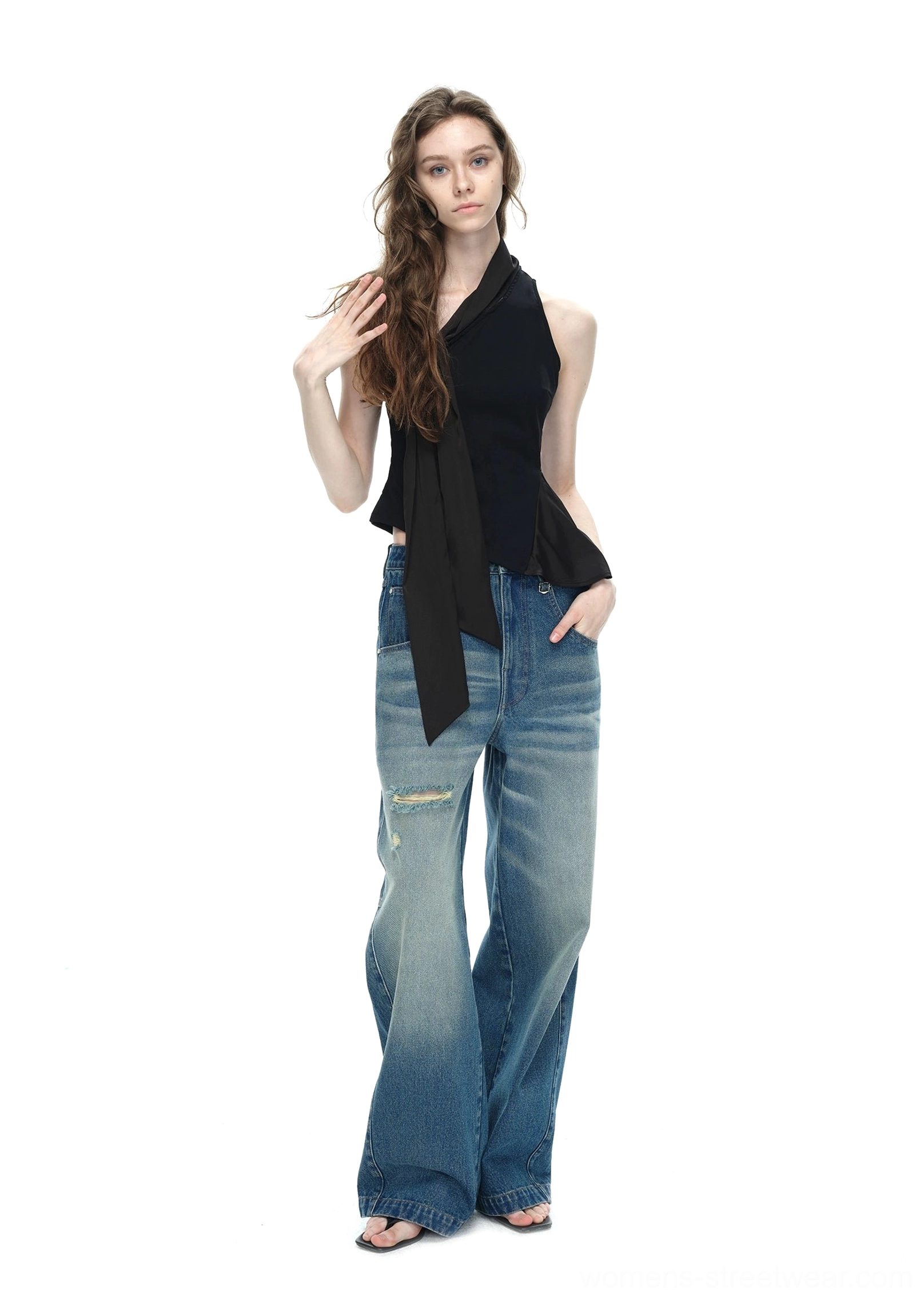 Black asymmetrical halter top casual front pose showing slim sleeveless fit flowing side tie and asymmetric hemline