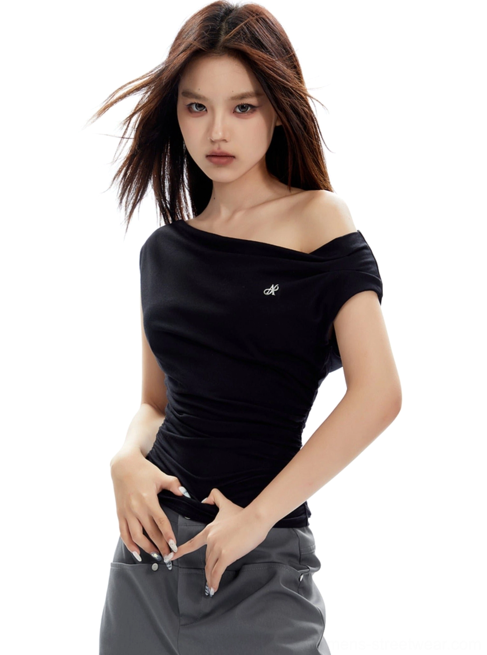 Three-quarter front view of black asymmetrical one-shoulder ruched top with a slim figure-hugging silhouette