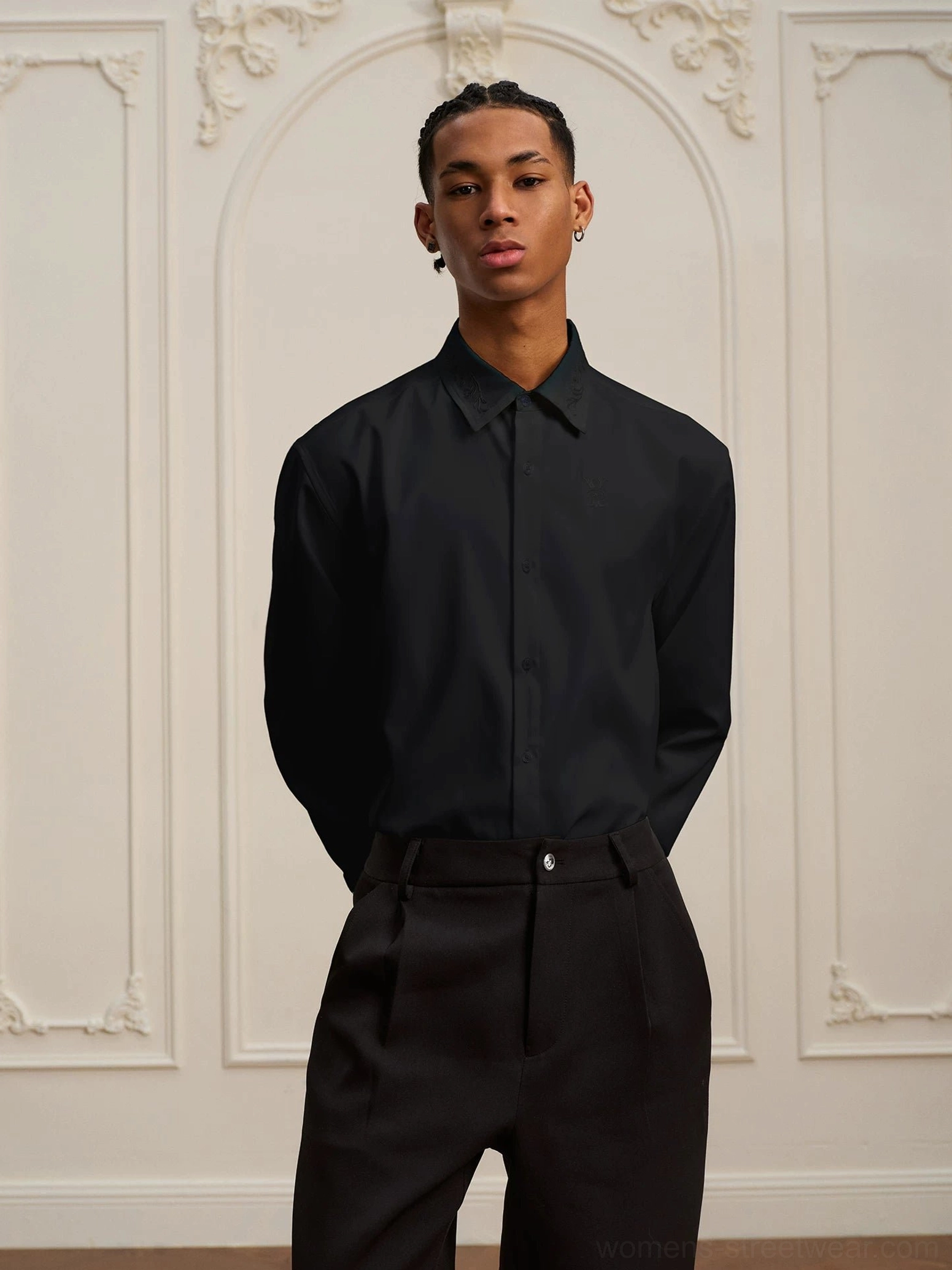Black baroque embroidered long-sleeve streetwear shirt styled with tailored black trousers for a relaxed formal outfit