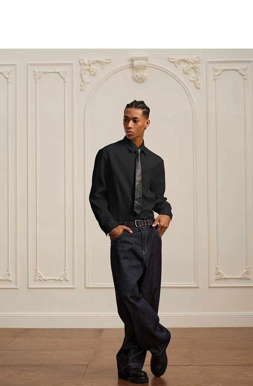 Black baroque embroidered long-sleeve shirt with leather belt and dark jeans in a relaxed Korean streetwear outfit