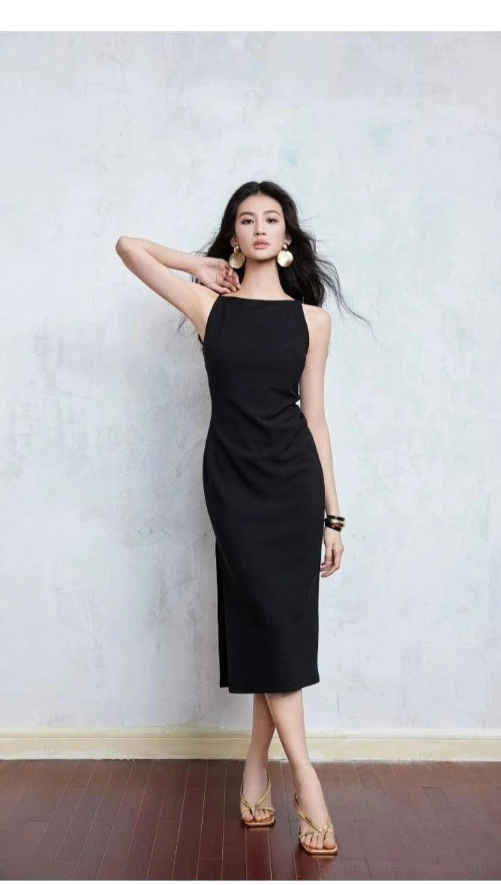 Black boat neck bodycon midi dress with fitted midi length styled with a slim black bracelet
