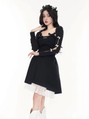 Full-body view of a black long-sleeve bow cardigan layered with a short dress and white knee-high boots in Korean streetwear style