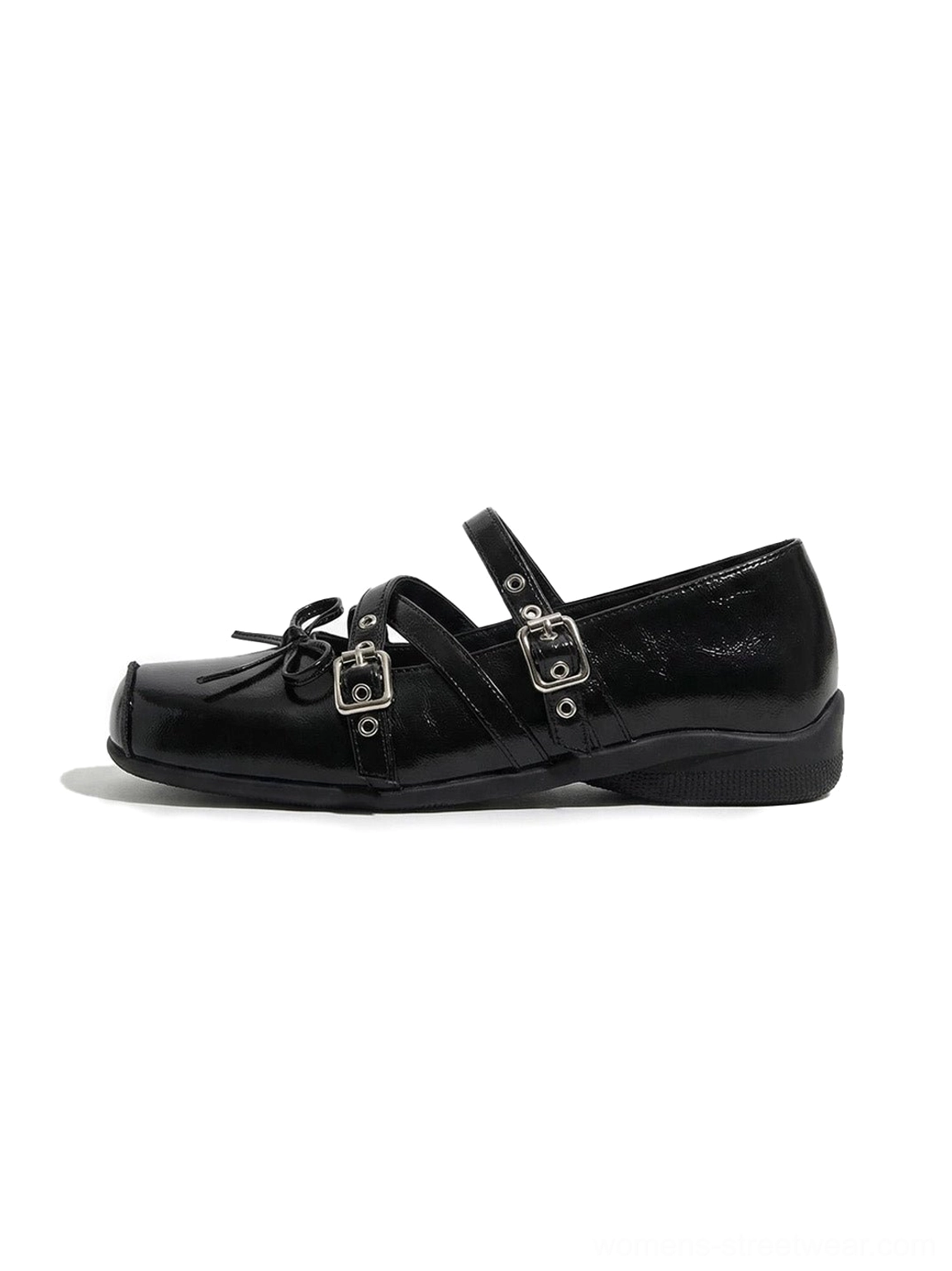 Black double-strap bow Mary Jane flats with square toe, glossy textured upper, silver buckle straps, and subtly lifted platform sole shown in a front three-quarter product view